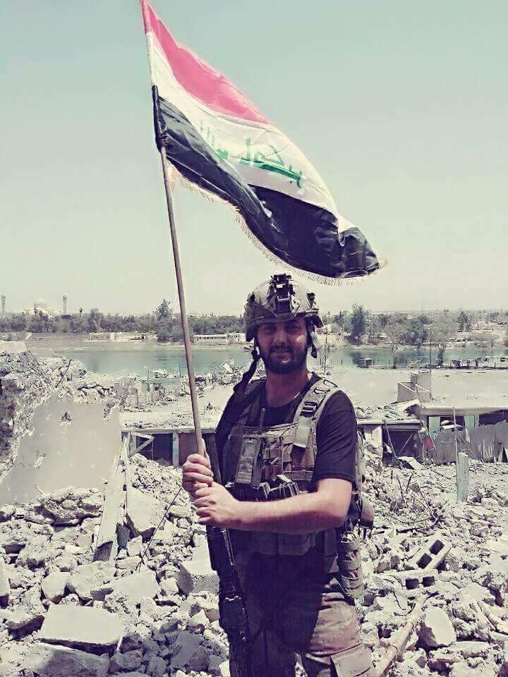 iraq: the iraqi flag is flying on the west bank of the tigris