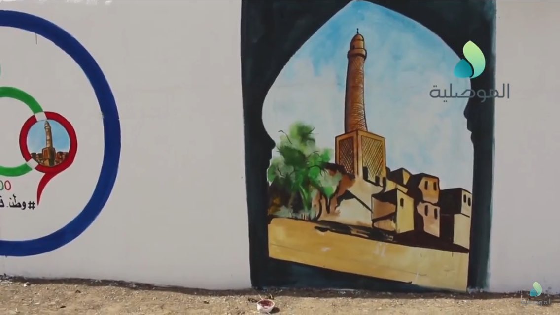 Volunteers paint over IS murals in Sumer neighborhood, East Mosul  
