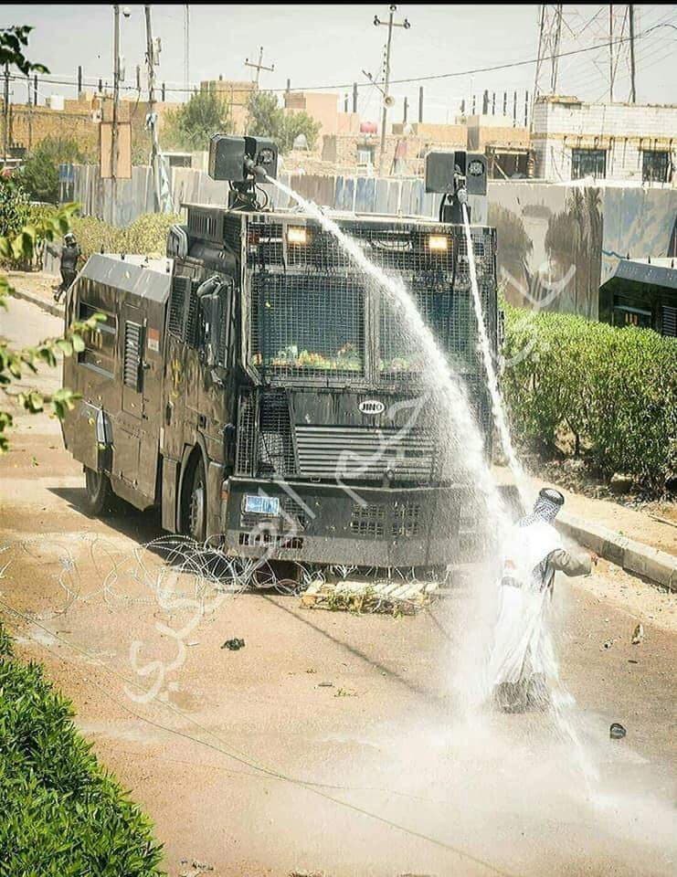 Photo: Shiekh Abdulzahara against water cannon in Dhi Qar, southern Iraq. #BasraProtests   