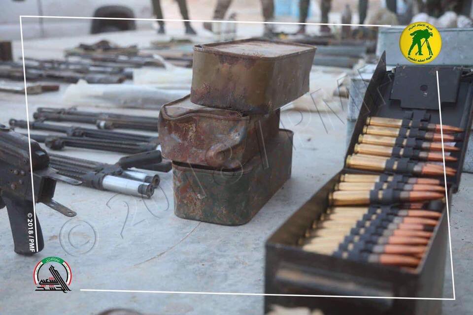 Hashd uncover a hidden stash of Daesh explosives and weapons west of Samarra Iraq