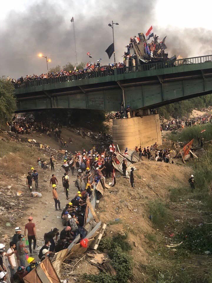 Photo: Al-Jumhuriya_Bridge from the protesters' side near Turkish restaurant building and al-Tahrir square at Baghdad.  Date unknown.