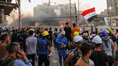 Security forces disperse demonstrators at Al-Rasheed Street in central Baghdad