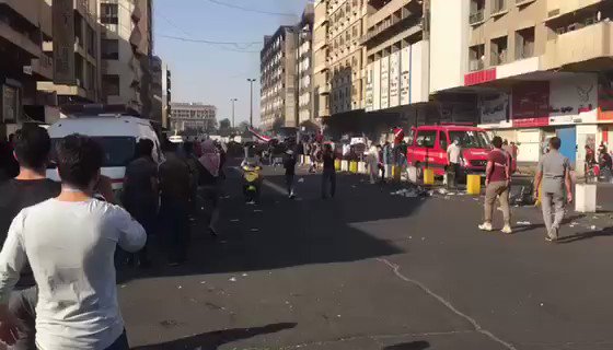 Today in Baghdad: Protesters near Tahrir Square flee security forces firing tear gas. Rights groups accuse security forces of lethally firing tear gas canisters directly at protesters and medical workers. Video: @Adam_Lucente