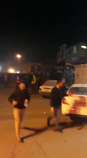 Government forces chase protesters in the alleys and streets of Najaf.