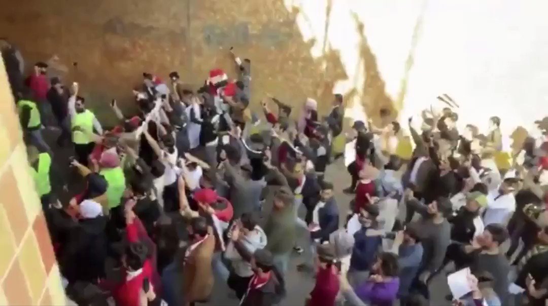 Large student crowds marching towards Baghdad's Tahrir Square