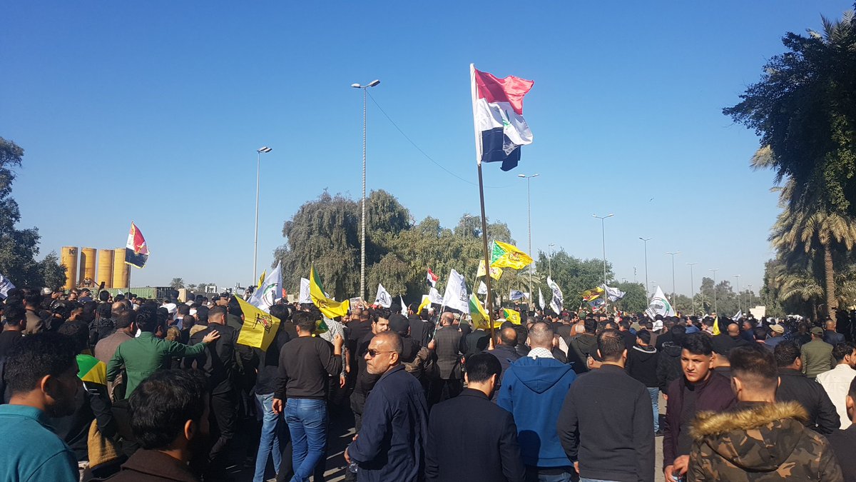 Hundreds, perhaps thousands of PMF have crossed the hanging bridge towards the fortified Green Zone, chanting anti-American slogans
