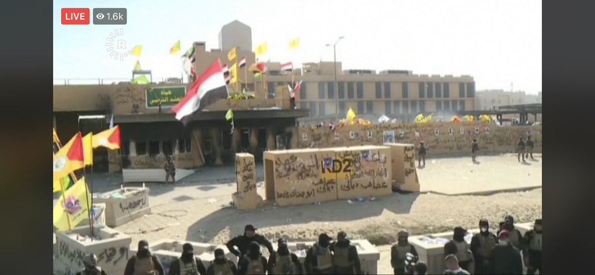 At the US embassy   in Baghdad it appears security forces   deployed in front of it and you can see the results from a night of fires and graffiti