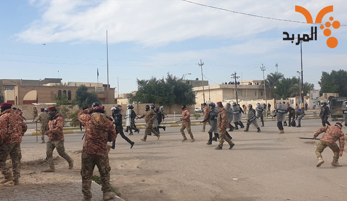 Stone throwing between demonstrators and security forces near the Western School in Kut