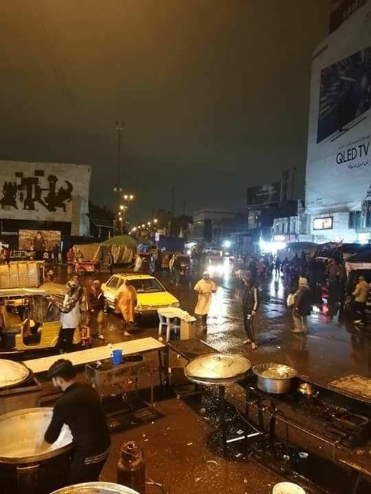 Demonstrations in Tahrir Square, central Baghdad, under rain showers