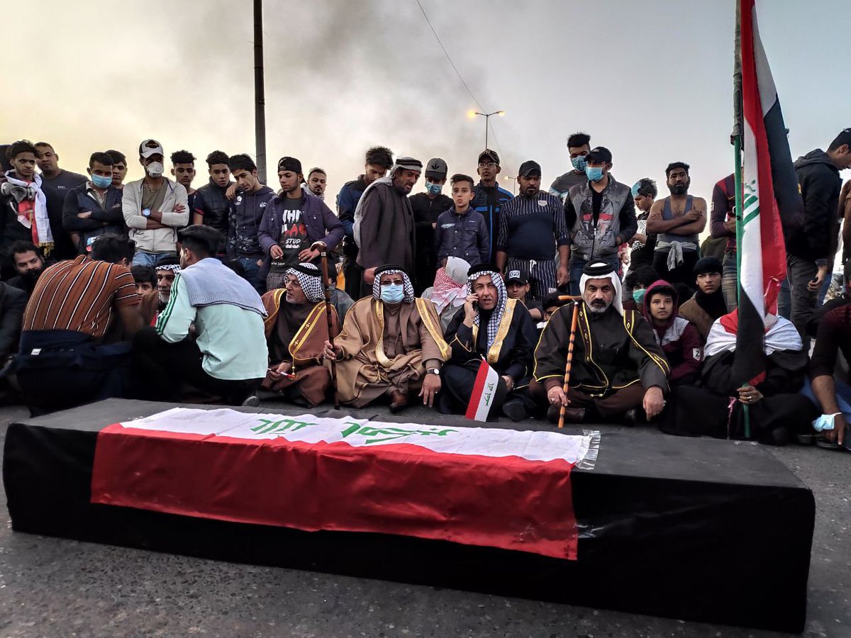 Large numbers of protesters cross the vital intersection of Kazeza 