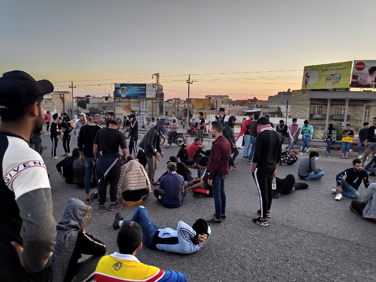 Large numbers of protesters cross the vital intersection of Kazeza 