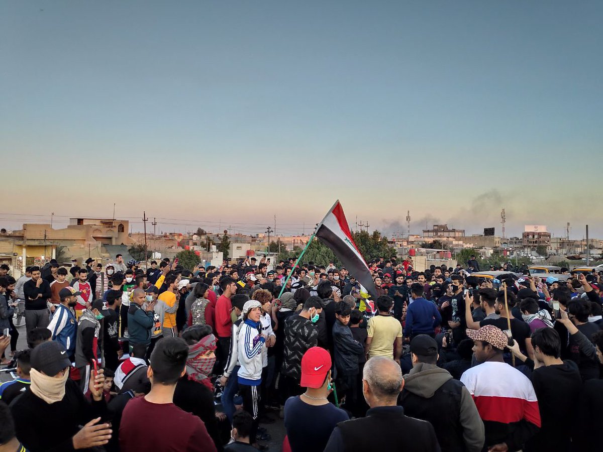 Large numbers of protesters cross the vital intersection of Kazeza 