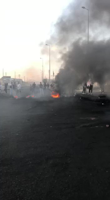 The demonstrators block the commercial intersection and Al-Andalus Street in Basra Governorate. 