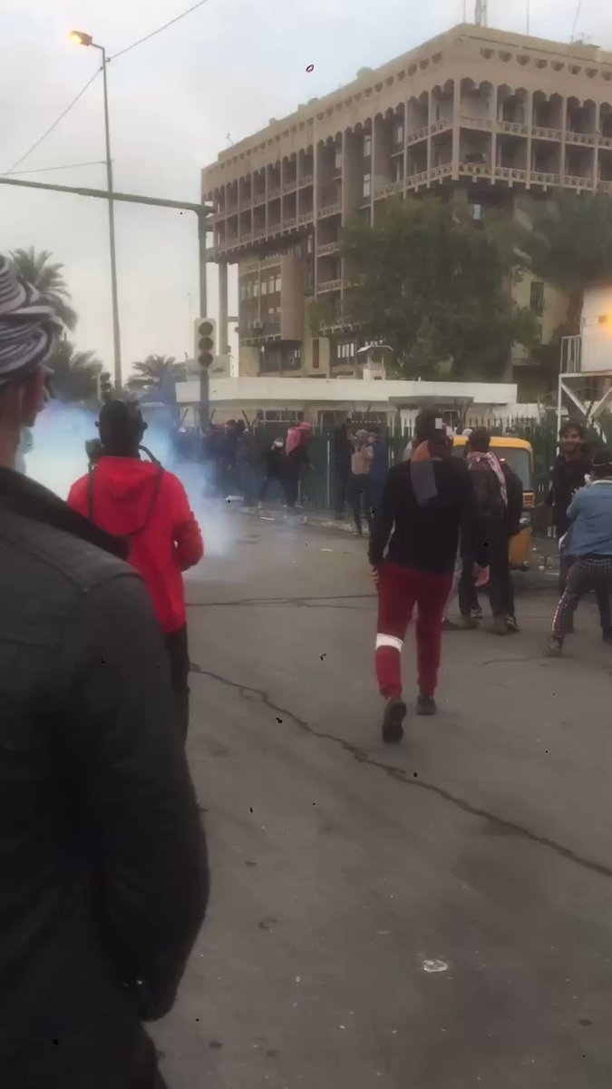 Iraq. Baghdad's central Wathba square, 25 January. Iraqi security forces firing live rounds and tear gas at anti-government demonstrators.  