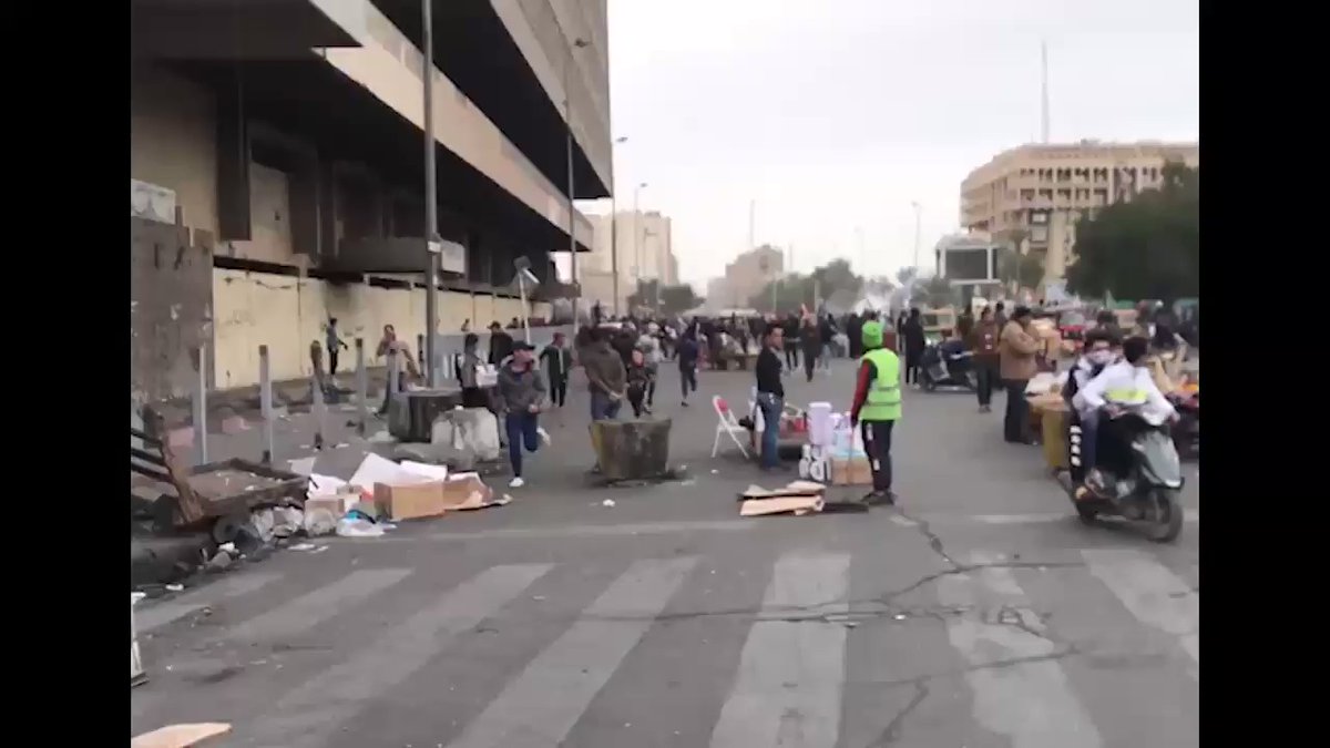 Government forces fire tear gas bombs at the demonstrators, near Al-Wathba Square in central Baghdad