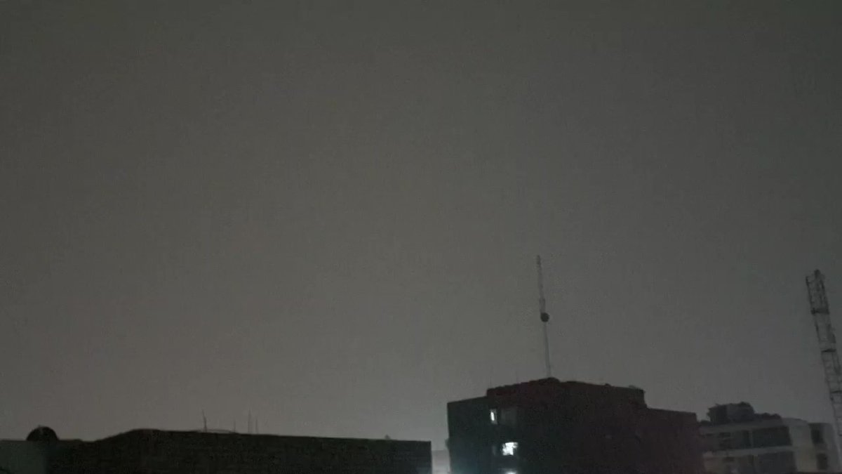 A rainy night in the capital, Baghdad, with the curfew approaching