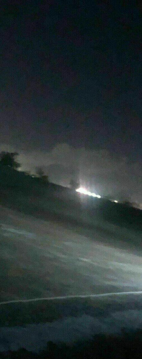 Photo shows smoke raises over Taji military base near Baghdad, Iraq after targeting it by 2 rockets . The base hosts US and other coalition forces
