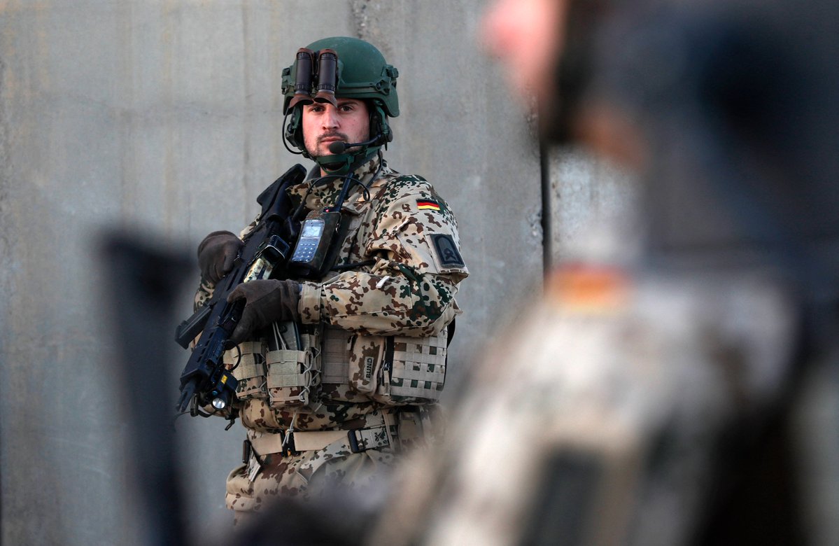 German Defense Minister Christine Lambrecht talks to German soldiers as she visits German armed forces in Erbil, the capital of the autonomous Kurdistan Region on January 9, 2022.  Safin Hamed/AFP