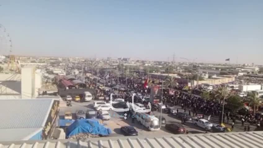 Huge crowds of mourners are waiting for the coffin in the holy city of Karbala.