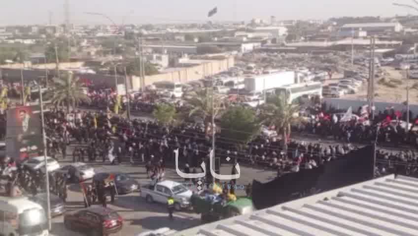 Huge crowds of mourners are waiting for the coffin in the holy city of Karbala.
