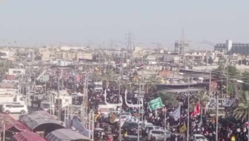 Huge crowds of mourners are waiting for the coffin in the holy city of Karbala.